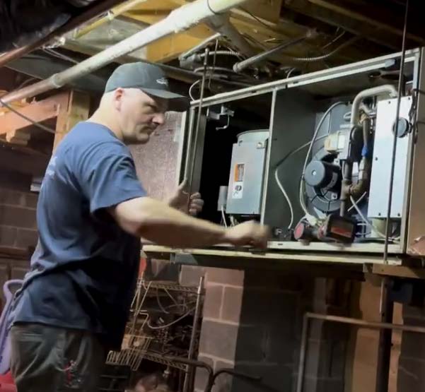 tech working on furnace